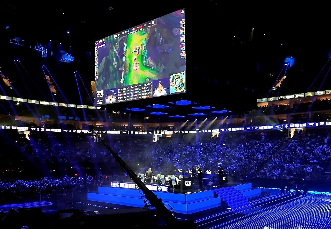 World Championship final stage World Championship final stage with T1 and Bilibili Gaming competing in front of a large arena crowd