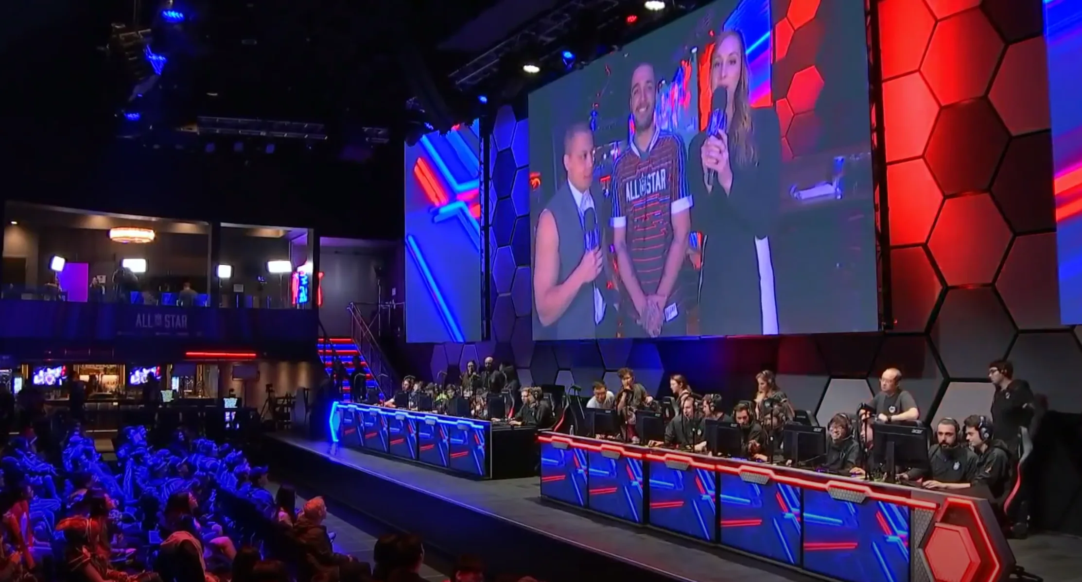 League of Legends esports stage with teams and large broadcast screen League of Legends esports stage with teams and large broadcast screen