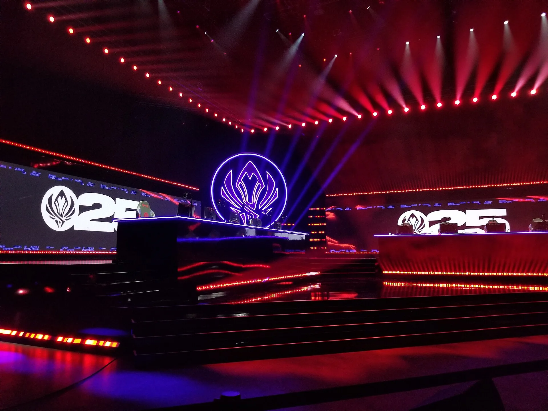 MSI stage with large screens and seated spectators inside an arena MSI stage with large screens and seated spectators inside an arena
