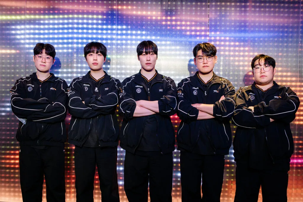 All members of team HLE standing with crossed arms. All members of team HLE standing with crossed arms.