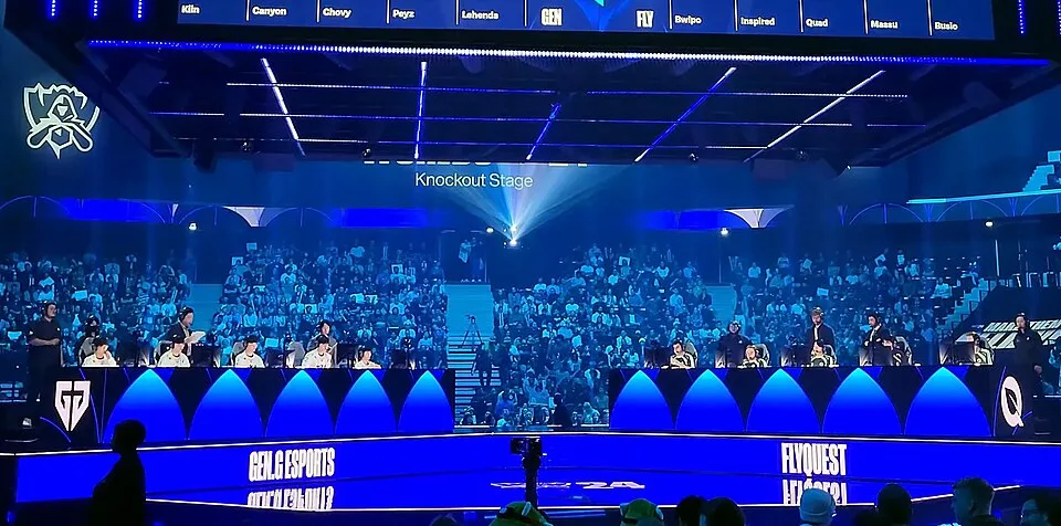 Worlds quarterfinal stage Gen.G and FlyQuest competing on stage during a World Championship quarterfinal