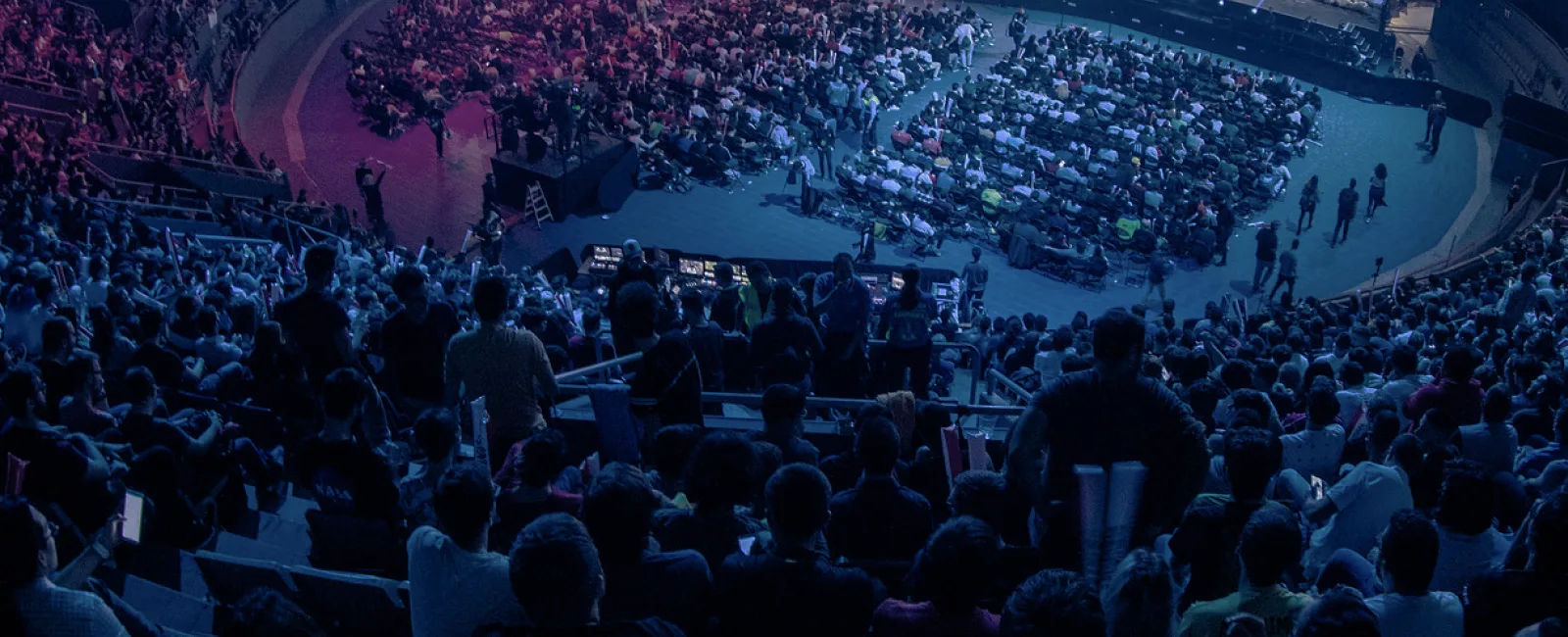 Large League of Legends arena crowd watching a finals stage Large League of Legends arena crowd watching a finals stage