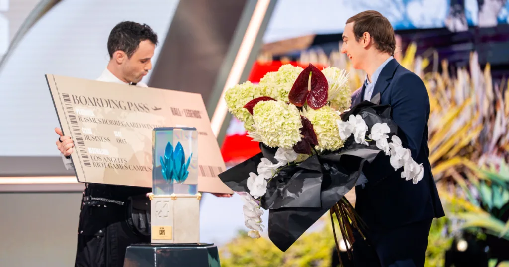 Caps recieving flowers and trophy.