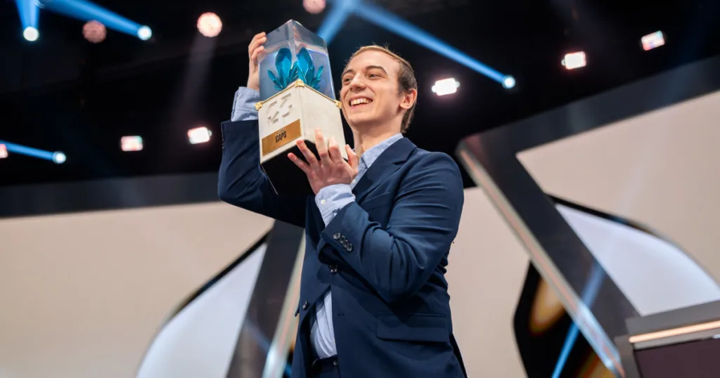 Caps holding the Hall of Legends trophy.