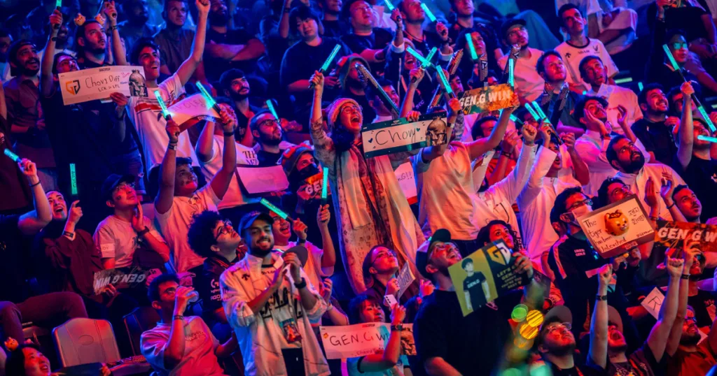 Fans cheering in the crowd at EWC 2025.