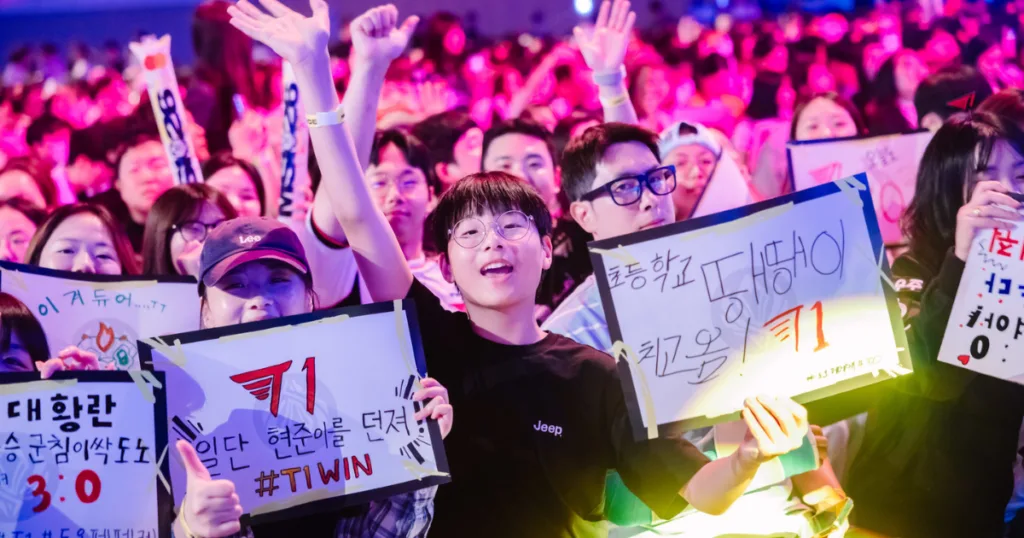 A fan cheering in the crowd for T1. A fan cheering in the crowd for T1.